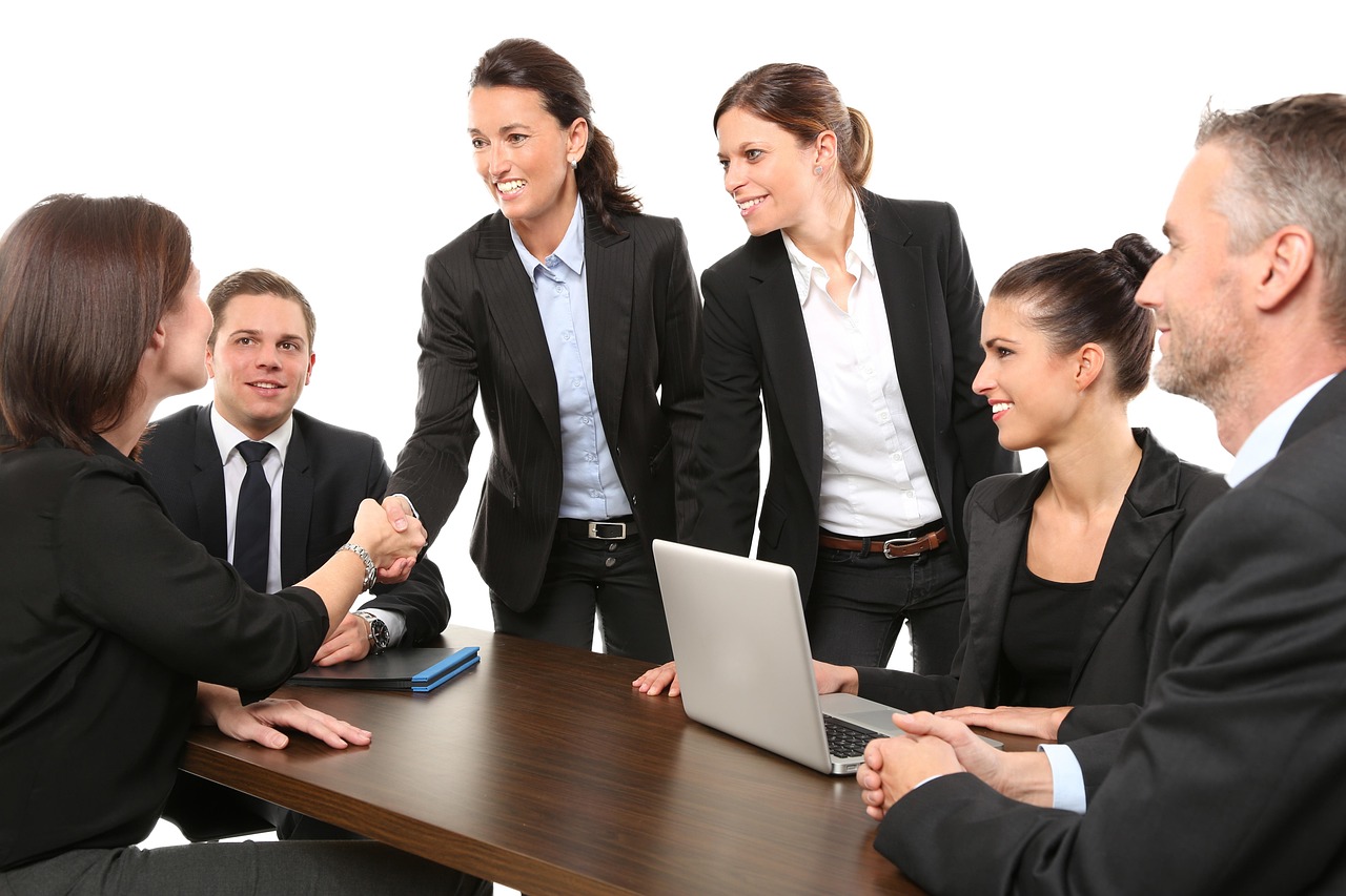 insurance office team meeting handshake